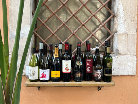 red wine bottles on shelf